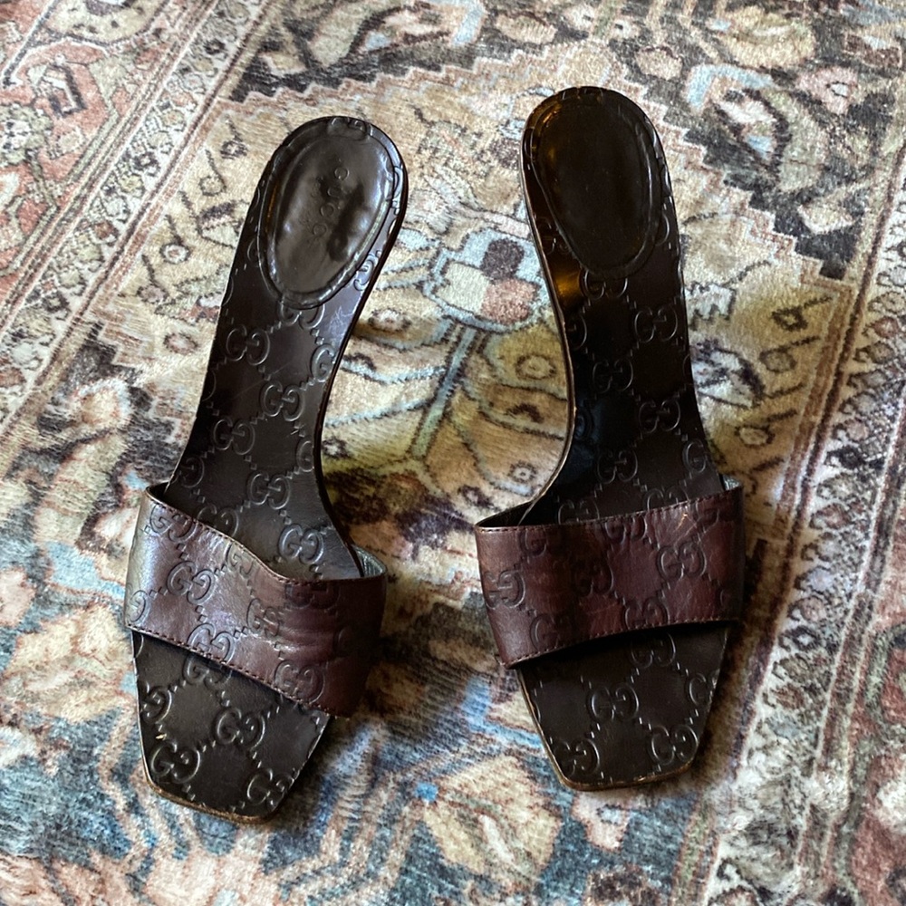 These are Gucci mules. Dark brown leather. They are used but in great condition.